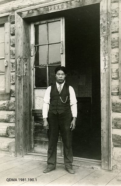 Chow Man in front of the Hing Kee Laundry