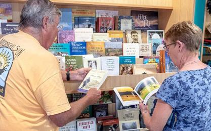 Man and woman looking at books