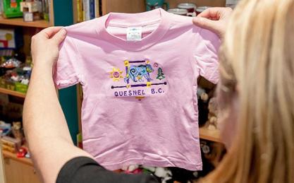 Woman holding pink kids Quesnel T-shirt